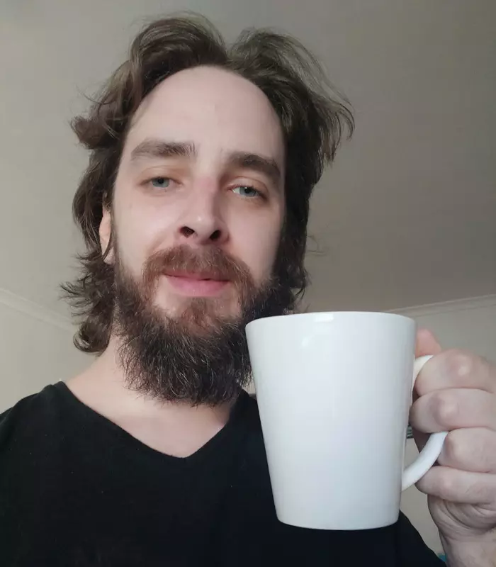 Photo of me having a cuppa in Adelaide, Australia while doing website design.